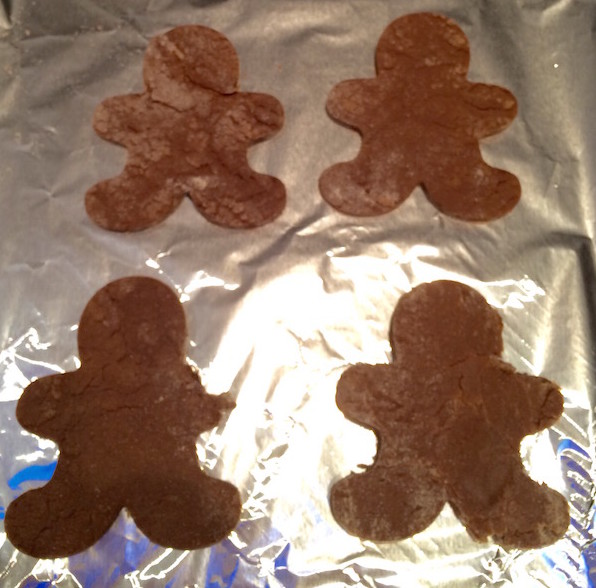 Gingerbread men cookies ready to bake on cookie sheet