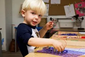 kindergarten boy with toys