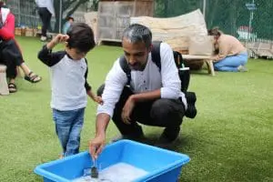 child and father at preschool