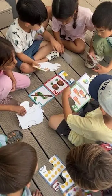 children working on brain games at preschool