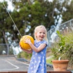 girl playing tetherball at preschool