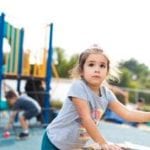 girl on outdoor playground at preschool