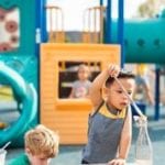 young boys having fun on playground at preschool