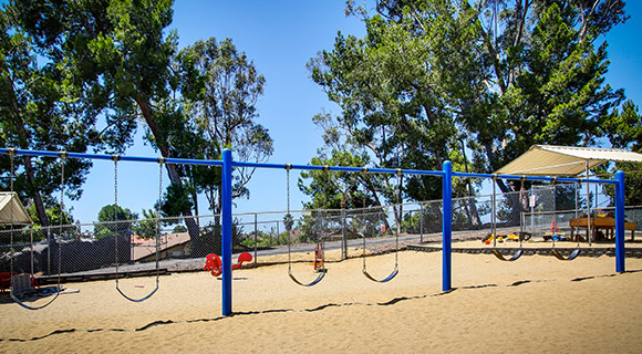 Come along and swing with me! The swings are a favorite past time on our pre-k and kindergarten-prep playground.
