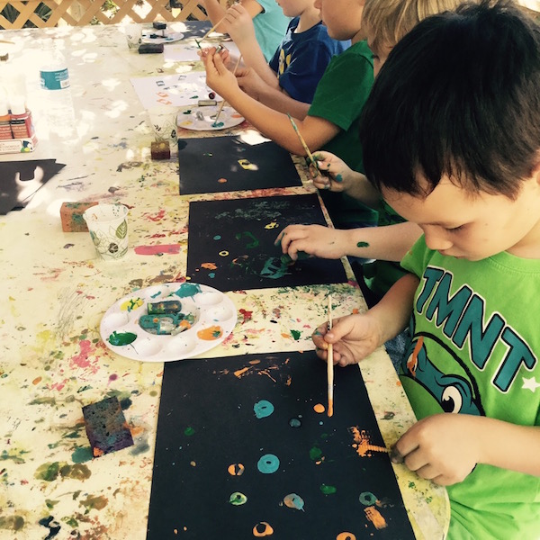 Kids art class with tools and paint