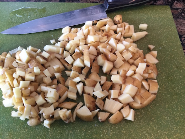 Chopped potatoes on cutting board
