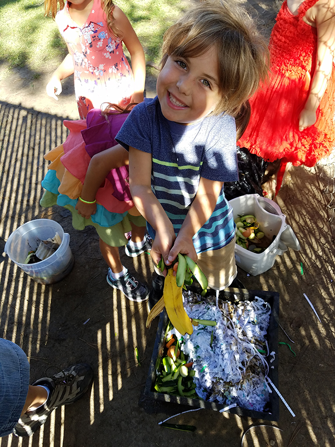 Toddlers enjoying composting!