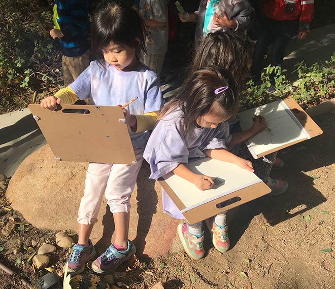 toddlers draw nature in a group at our preschool