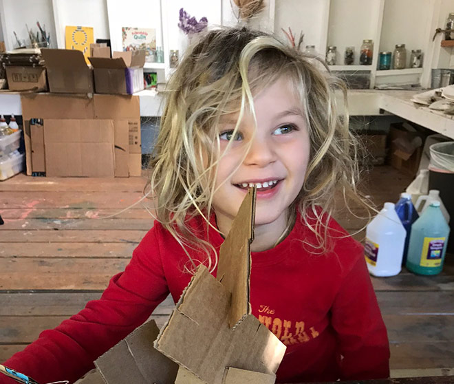 Toddler build with cardboard at our preschool
