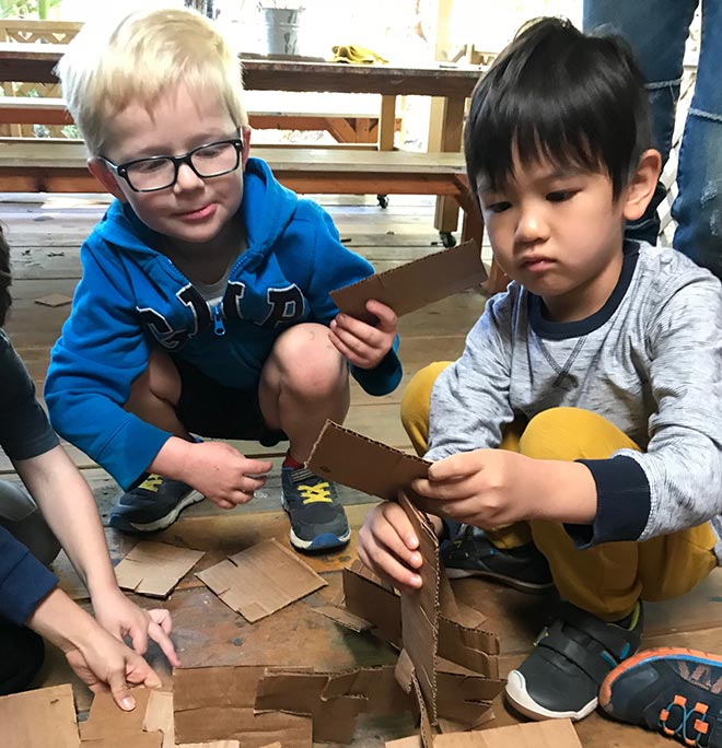 kids build cardboard sculptures at our preschool
