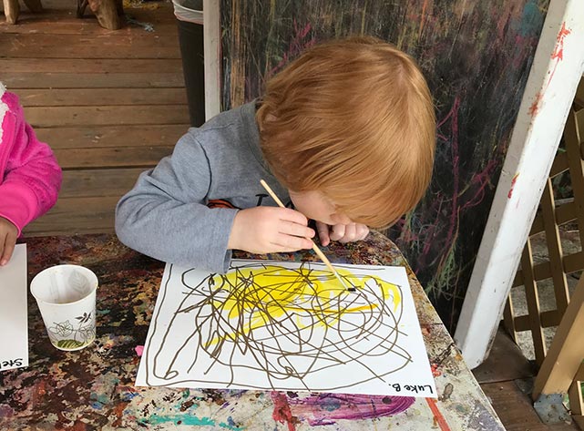 toddler draws with sharpies at our preschool