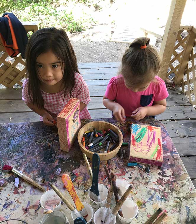 toddler girls work on mothers day presents
