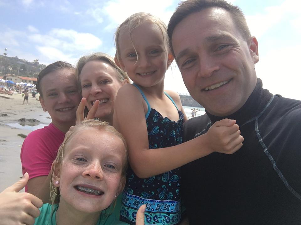 tom with his children at the beach