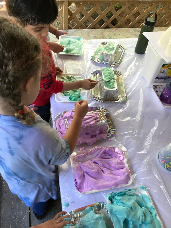 Kids working on an art project together at our daycare