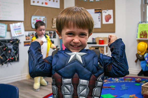 boy in costume at child care center
