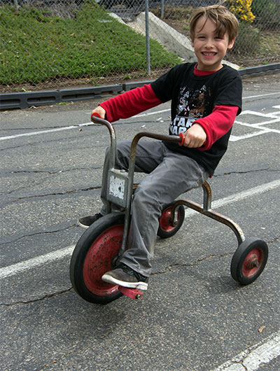 boy riding bike at child care center