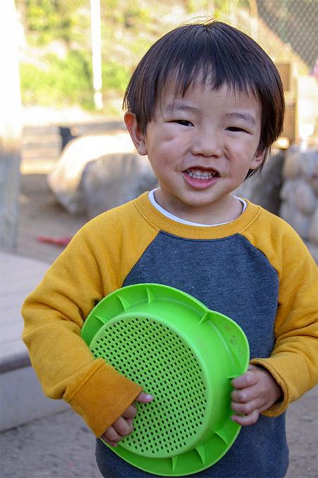 boy with plate at chlid care center