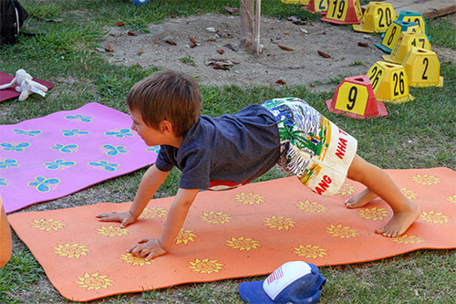 child doing yoga at summer camp