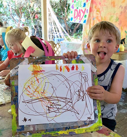 boy scribbling at daycare center