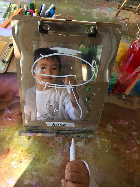 faces on a mirror at daycare