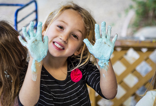 girl with funny hands at daycare