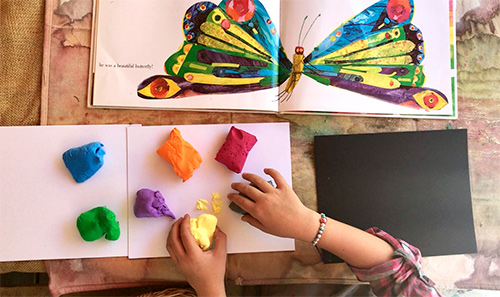 building a clay butterfly at preschool