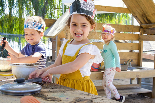 child learning outdoors at preschool