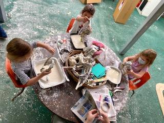 preschool students making paper mache at preschool