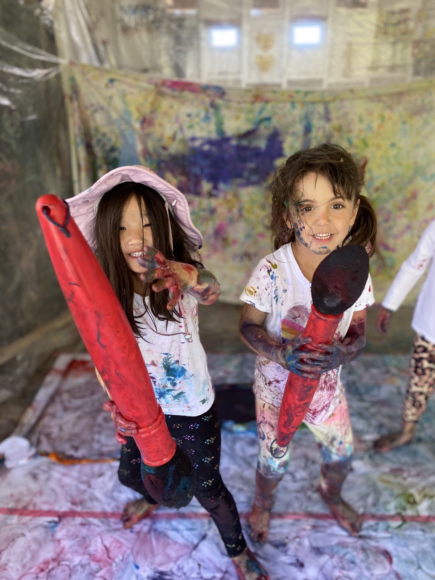 girls doing messy art at preschool