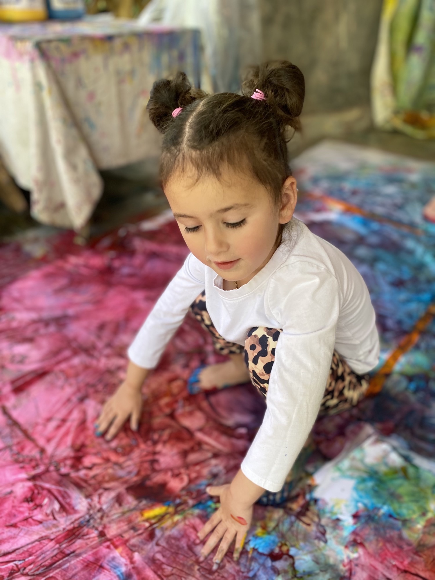 young girl exploring art