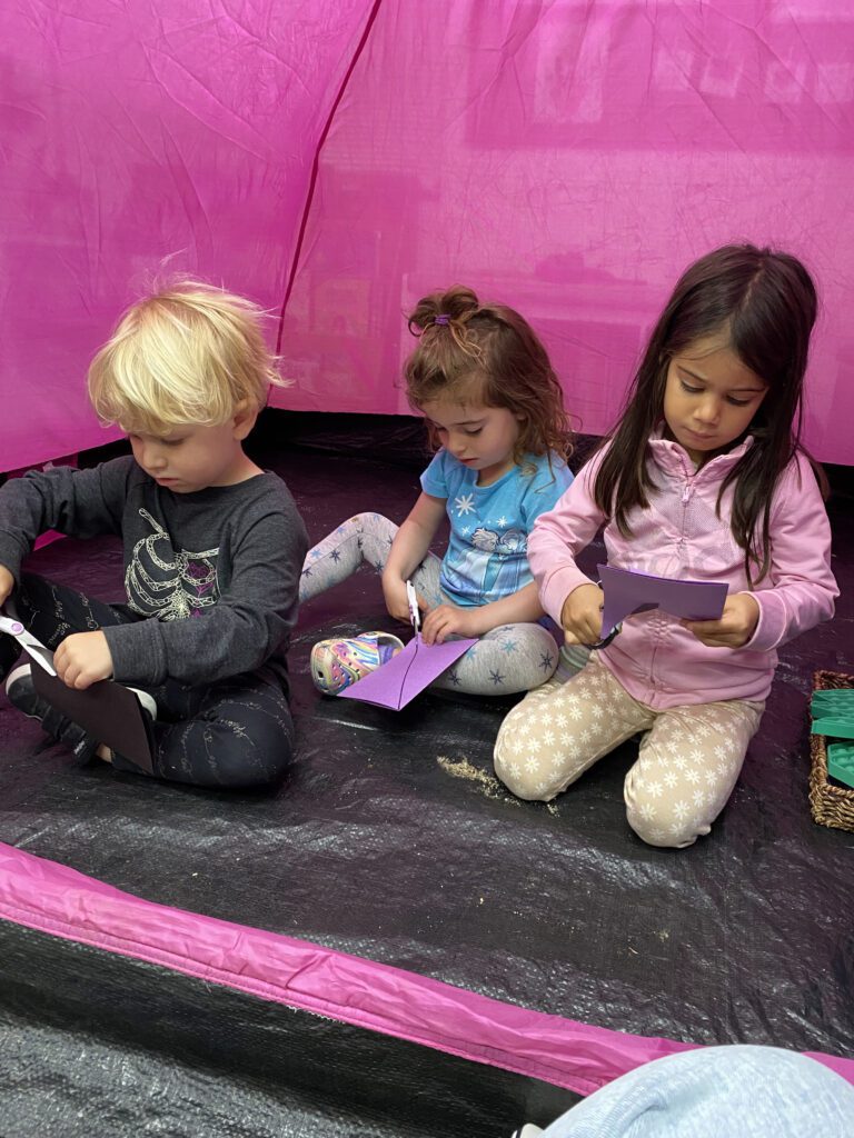 children in tent at preschool