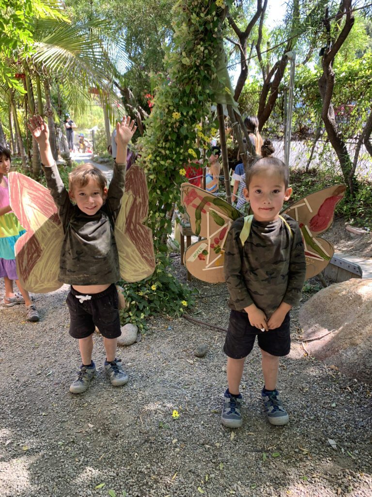 boys with giant butterfly art project front