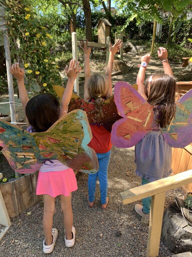 group of girls with butterfly art project