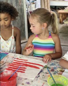 two girls painting at preschool