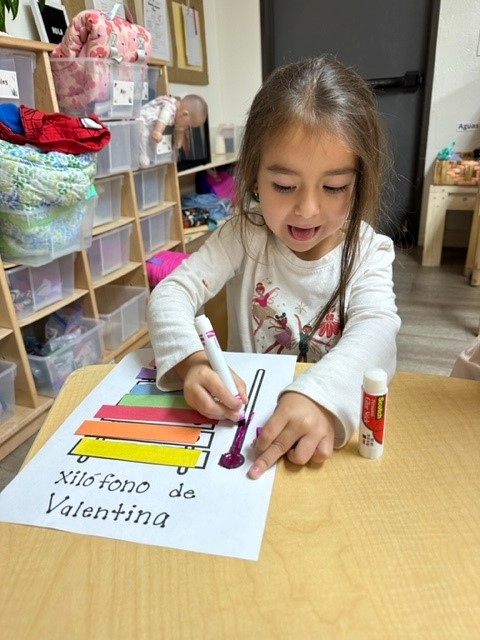 young girl learning spanish at daycare