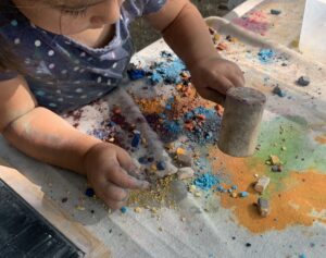 young girl with colorful chalk