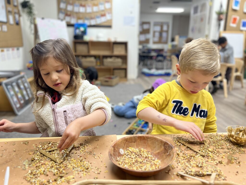 kids making bird feeders at preschool
