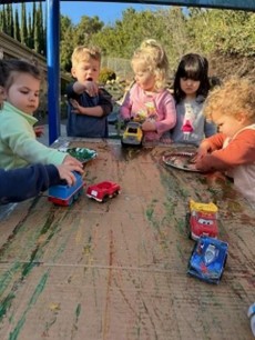 children painting with cars
