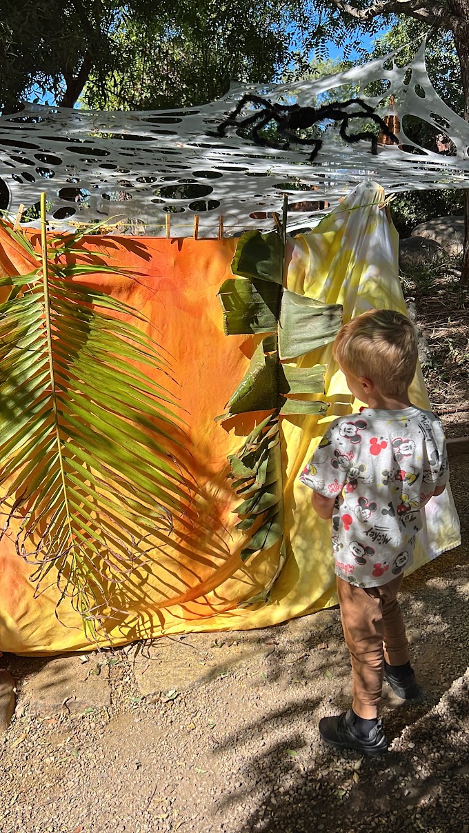 boy creating outdoor process art
