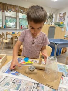 children at preschool with recycled art