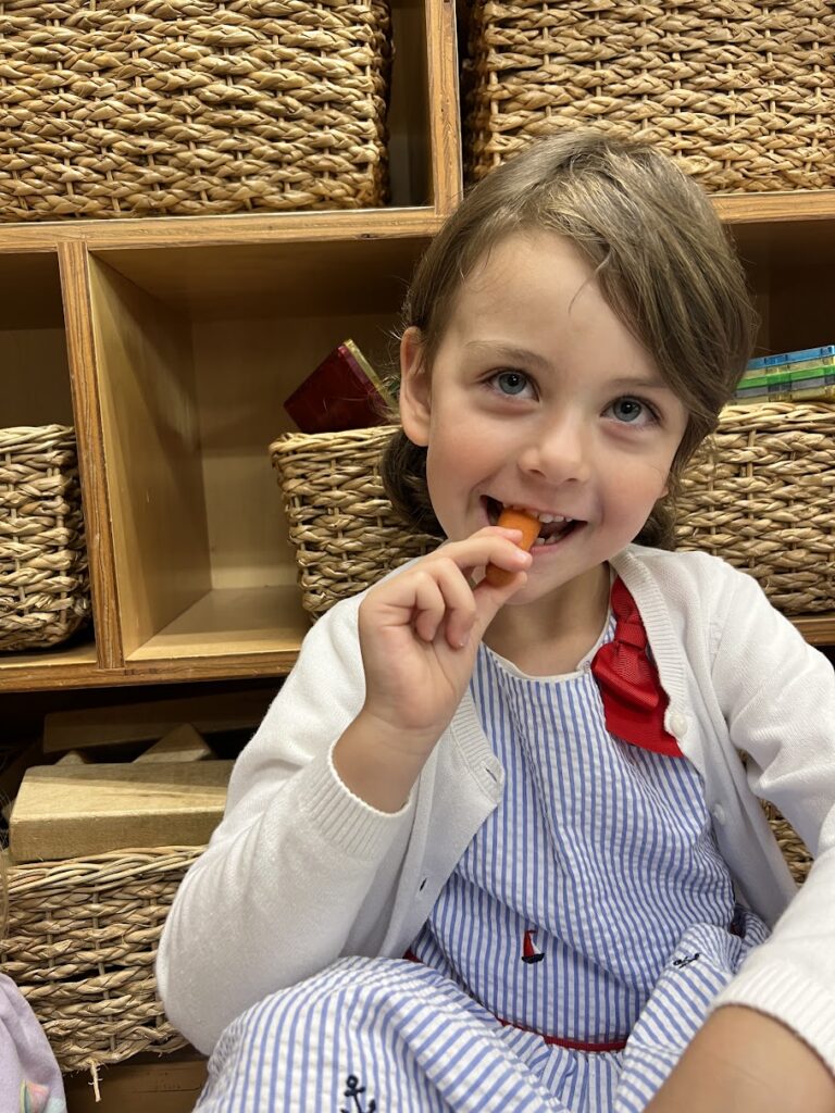 preschooler eating carrot