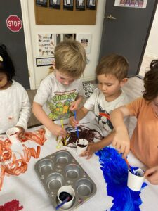 preschool boys painting together