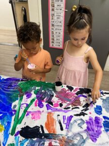 preschoolers painting together